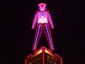Burning Man in all his glory atop the obelisk; with fortuitous blur.