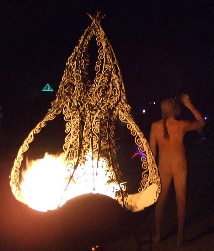 With these flames they will burn the man - Burning Man - not that naked man there.