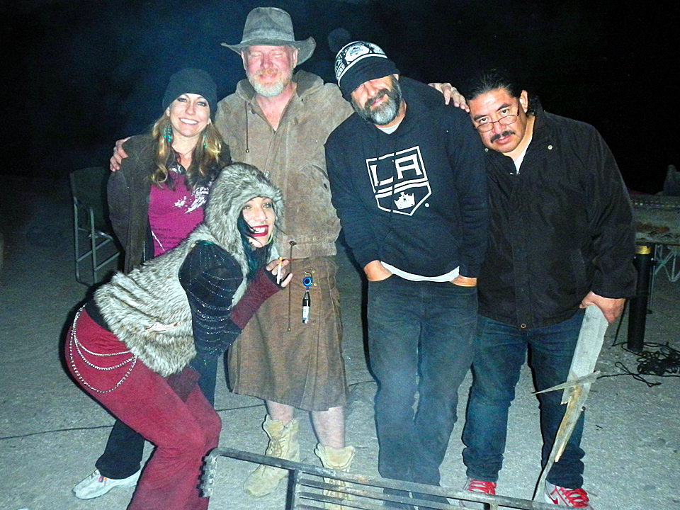 Fun people around the campfire. Fun people around the campfire.